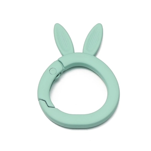Close-up of mint green matte alloy rabbit ear spring ring buckle for keychains