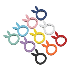 Macro shot of colorful matte rabbit-ear spring O-rings for DIY bags and keychains