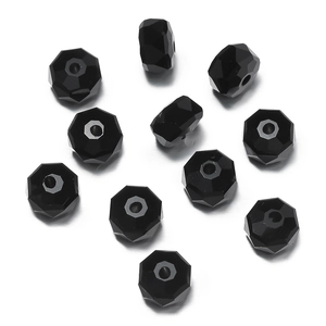 Macro shot of faceted black glass beads with center holes for DIY jewelry making crafts