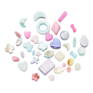Close-up of pearlized colorful shell beads in star, heart, moon, and butterfly shapes