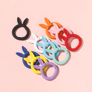 Macro shot of colorful matte bunny-ear spring rings and snap hooks for DIY accessories