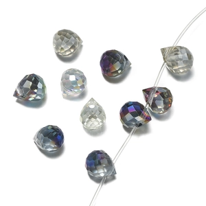 Macro detail of faceted crystal teardrop beads with iridescent coating and pre-drilled holes