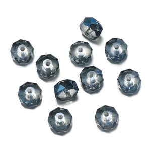 Macro detail of deep blue faceted glass beads with precision geometric cut and center hole