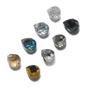 Close-up of faceted 6x7mm drop crystal glass beads in assorted colors for DIY jewelry making