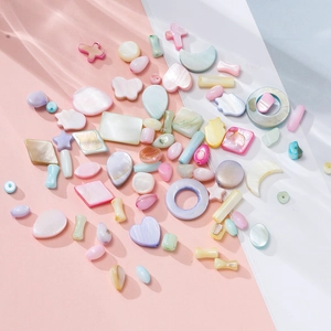 Detailed view of colorful iridescent mother-of-pearl charms for DIY jewelry making