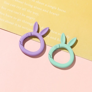 Detail of purple and mint green bunny ear spring ring hooks with matte lacquer finish