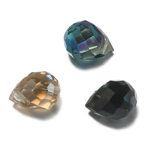 Macro detail of faceted crystal glass teardrop beads in blue, amber and black colors