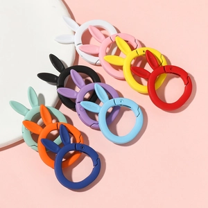Macro view of colorful matte rabbit-ear spring rings for keychains and bag accessories