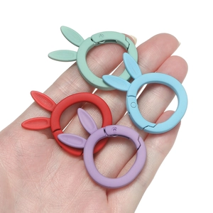 Detail of colorful matte bunny spring buckles in red, blue, purple and green for DIY crafts