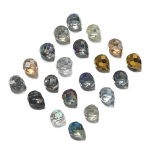 Macro view of multi-colored teardrop crystal glass beads with diamond facets for DIY jewelry