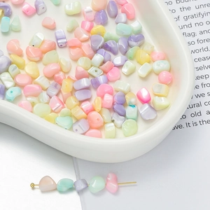 Detail of colorful macaron irregular stone beads with pearlescent shell texture for DIY