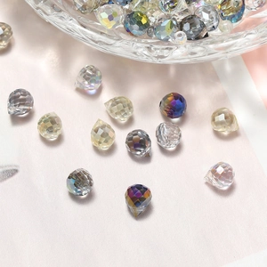 Close-up of faceted glass crystal teardrop beads for DIY jewelry making in various colors