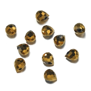 Close-up of golden faceted water-drop crystal beads for DIY jewelry making