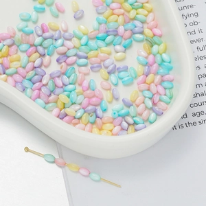 Macro shot of colorful rice-shaped iridescent beads in Macaron tones for DIY jewelry making