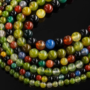 Detailed macro shot of assorted colorful dragon vein agate beads for DIY jewelry