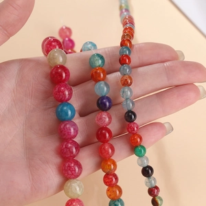 Close-up of multicolored dragon vein agate beads with crackle patterns for DIY jewelry