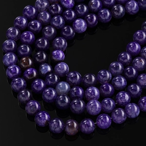 Macro shot of purple dragon vein agate beads with cracked texture for DIY jewelry