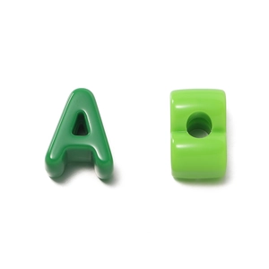 Macro shot of green acrylic letter A beads with large holes for DIY jewelry making