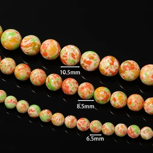 Detailansicht bunter Kaiserstein-Rundperlen in den Größen 6,5 mm, 8,5 mm und 10,5 mm