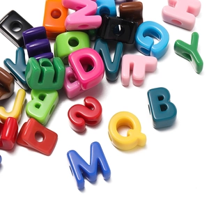 Macro shot of colorful acrylic alphabet beads with large holes for DIY jewelry making