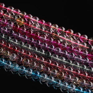 Macro shot of colorful gemstone beads showing natural internal ice cracks and texture