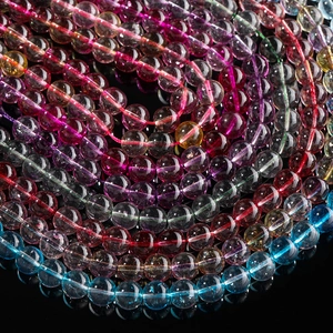 Close-up of vibrant colorful glass crystal round beads with natural texture and high gloss