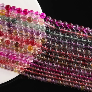 Close-up of colorful tourmaline round beads with natural textures for jewelry making