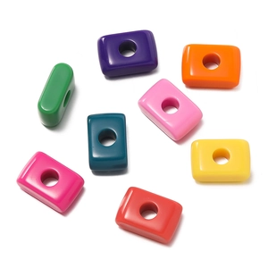 Macro shot of colorful acrylic rectangle beads with large holes for DIY jewelry making