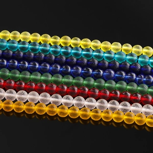 Macro shot of colorful frosted glass round beads for DIY jewelry making set