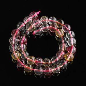 Macro detail of multicolored translucent quartz beads showing natural textures and gloss