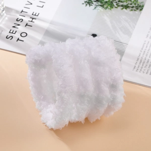 Detail of 2cm thick white coral fleece plush strip with dense texture for DIY crafts
