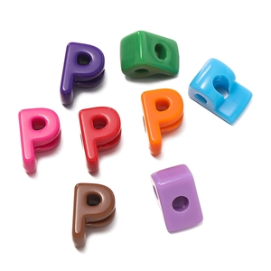 Macro view of colorful letter P acrylic beads with large holes for DIY jewelry making