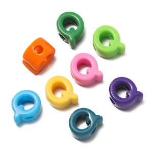 Close-up of letter Q acrylic large hole beads in diverse vibrant colors for DIY jewelry