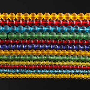 Macro shot of colorful glass spacer beads for DIY jewelry with frosted matte texture