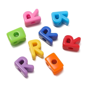 Close-up of colorful acrylic letter R beads with large holes for DIY jewelry making