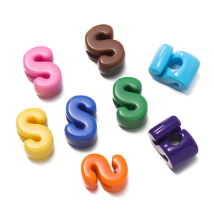 Colorful S-shaped plastic connector hooks in vibrant assorted colors on white background