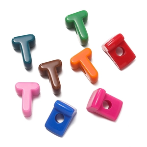 Close-up of colorful acrylic letter T beads with large holes for DIY jewelry making