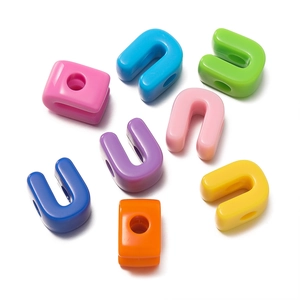 Close-up of colorful U-shaped acrylic jewelry connectors for DIY jewelry making