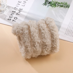 Close-up of thick plush off-white hair band with dense faux fur texture for DIY craft