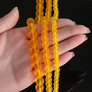 Frosted yellow Czech glass moldavite style round beads in 6mm, 8mm, and 10mm sizes