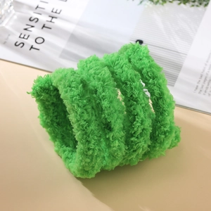 Close-up of bright green 2cm thick plush chenille stems for DIY craft accessories
