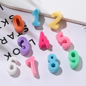 Macro shot of colorful 3D acrylic number beads 0-9 for DIY jewelry making