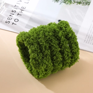 Close-up of 2cm thick grass green coral fleece plush strip for DIY handmade projects