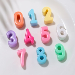 Detailed macro shot of colorful acrylic number beads for DIY jewelry making and crafts