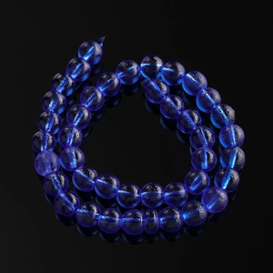 Detail view of 10mm frosted dark blue glass beads with textured matte finish for DIY jewelry