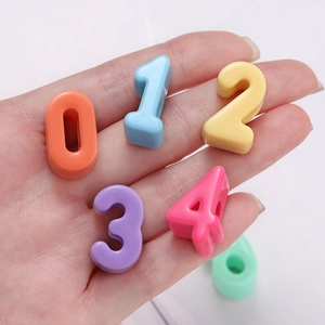 Macro shot of colorful candy-colored acrylic number beads for DIY jewelry and bracelets