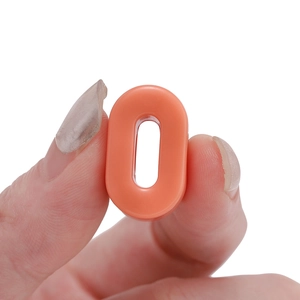 Close-up of an orange acrylic large-hole oval bead for DIY jewelry and bracelet making