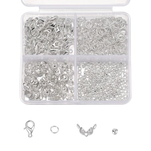 Detailed set of silver lobster clasps, jump rings and crimp beads in a 4-slot plastic storage box