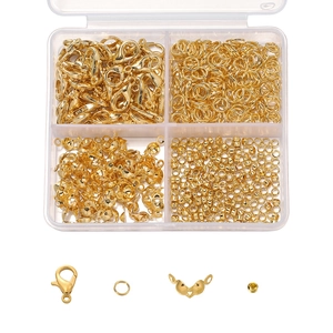 DIY jewelry making kit with golden lobster clasps and open rings in a 4-compartment box