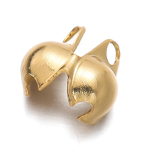 Close-up of golden foldable ball crimp beads with double loops for DIY jewelry making